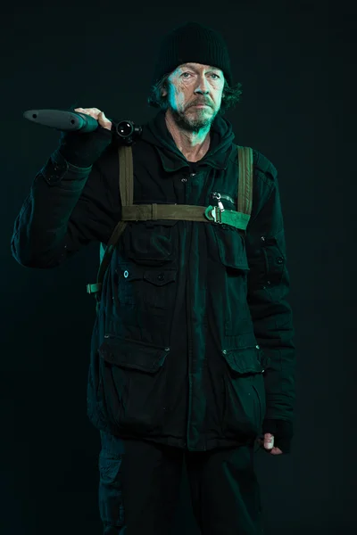 Sniper with beard in black holding gun. Studio shot. — Stock Photo, Image