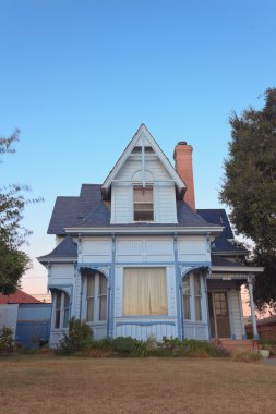 Old american victorian house at sunset. USA. California.