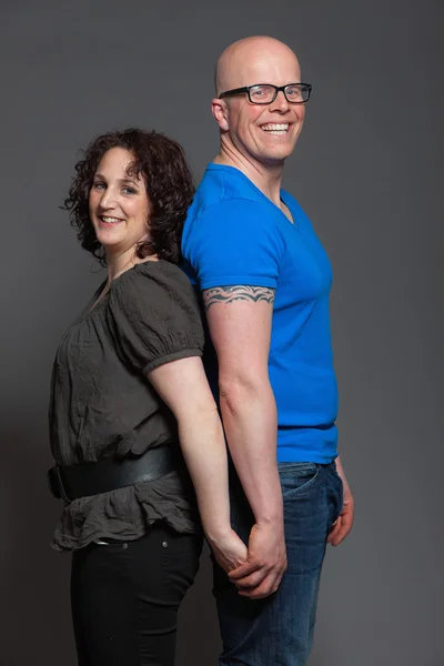 Happy young couple in love together. Studio shot. — Stock Photo, Image