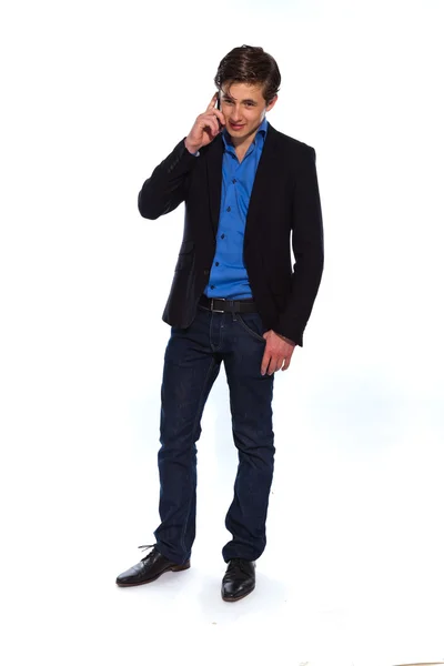 Młody biznesmen z telefon na sobie niebieską kurtkę. ja — Zdjęcie stockowe