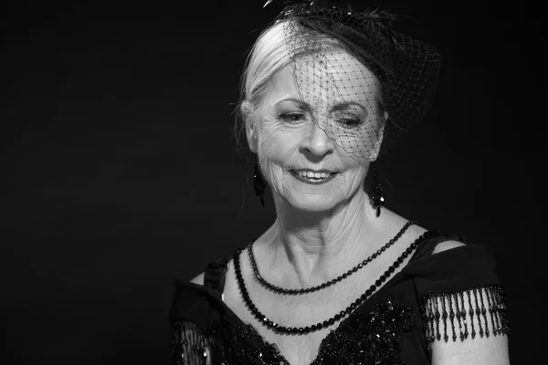 Vintage glamour studio portrait of senior woman. Black and white — Stock Photo, Image