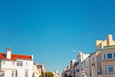 Street with houses of San Francisco with blue sky. clipart
