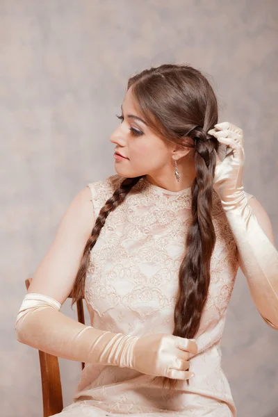 Vintage romantic fashion brunette woman. Doing her hair. Marble — Stock Photo, Image