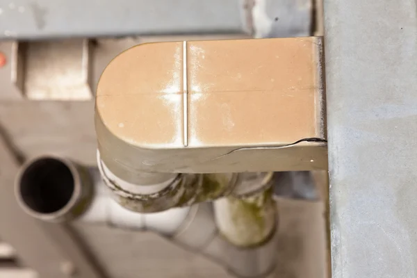 Top view close-up of broken plastic rain drain on roof. — Stock Photo, Image