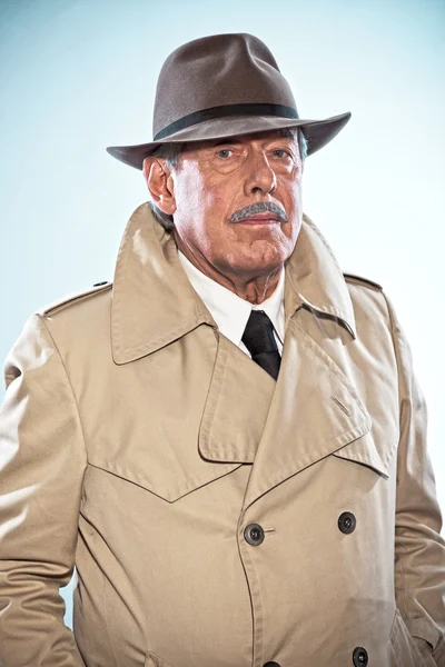 Vintage detective man with moustache and hat. Wearing raincoat. — Stock Photo, Image