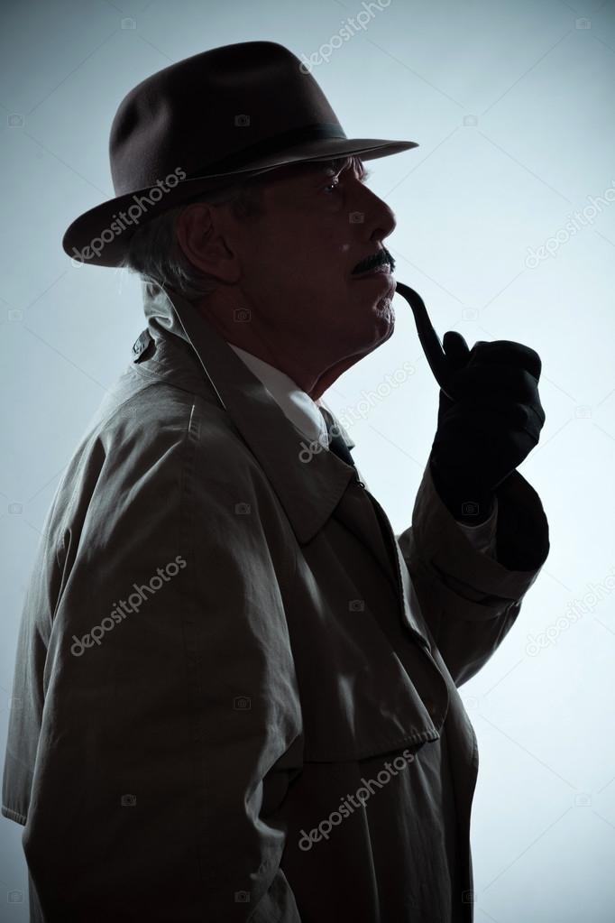 Silhouette of vintage detective with mustache and hat. Smoking p