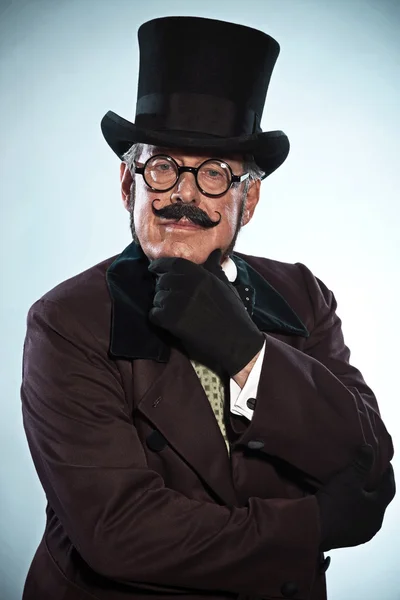 Vintage dickens style man with mustache and hat. Wearing glasses — Stock Photo, Image