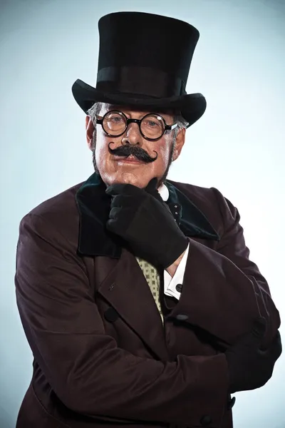 Vintage dickens style man with mustache and hat. Wearing glasses — Stock Photo, Image