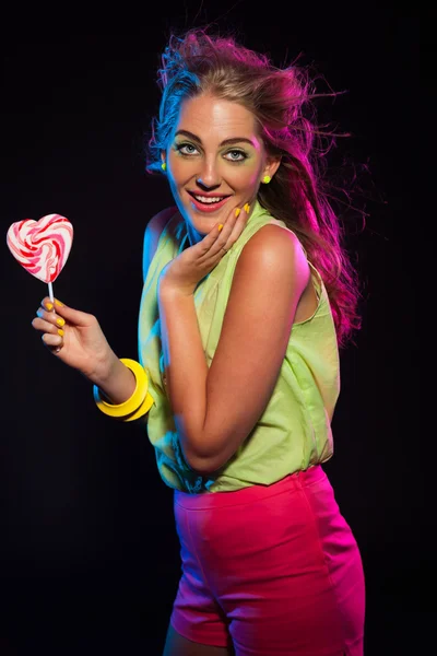 Happy retro 80s fashion disco girl with blonde hair and lollipop — Stock Photo, Image