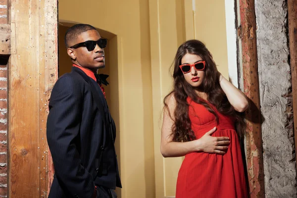 Retro fashion mixed race wedding couple wearing black suit and r — Stock Photo, Image