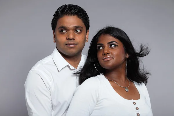 Young romantic indian couple. Wearing white shirt and jeans. Stu — Stock Photo, Image