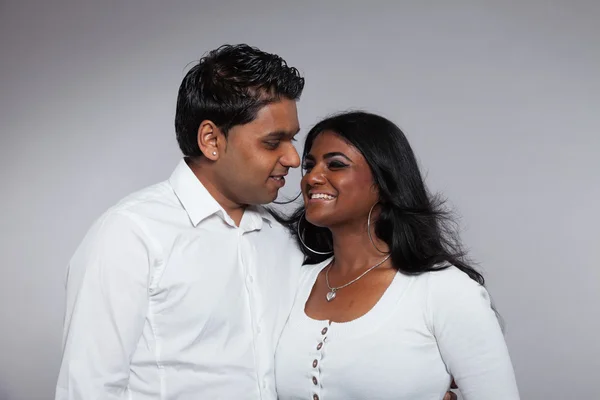 Young romantic indian couple. Wearing white shirt and jeans. Stu — Stock Photo, Image