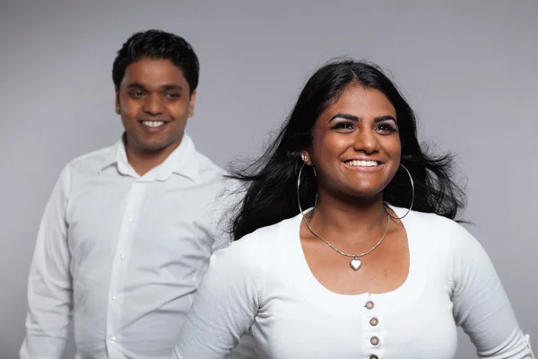 Young romantic indian couple. Wearing white shirt and jeans. Stu — Stock Photo, Image