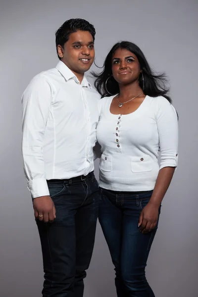 Young romantic indian couple. Wearing white shirt and jeans. Stu — Stock Photo, Image