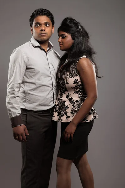 Fashionable passionate indian couple. Studio shot against grey. — Stock Photo, Image