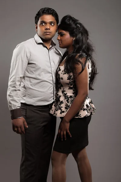 Fashionable passionate indian couple. Studio shot against grey. — Stock Photo, Image