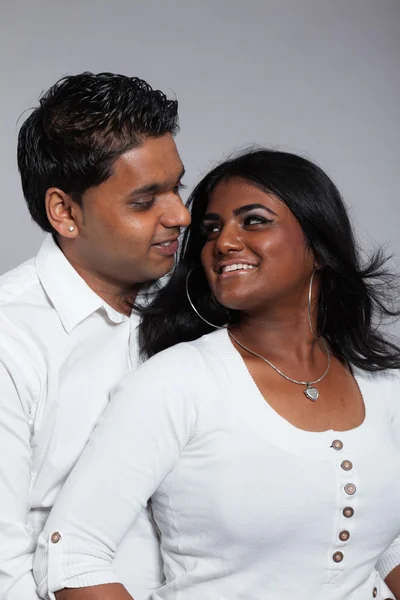 Young romantic indian couple. Wearing white shirt and jeans. Stu — Stock Photo, Image