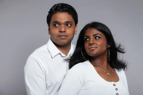 Young romantic indian couple. Wearing white shirt and jeans. Stu — Stock Photo, Image