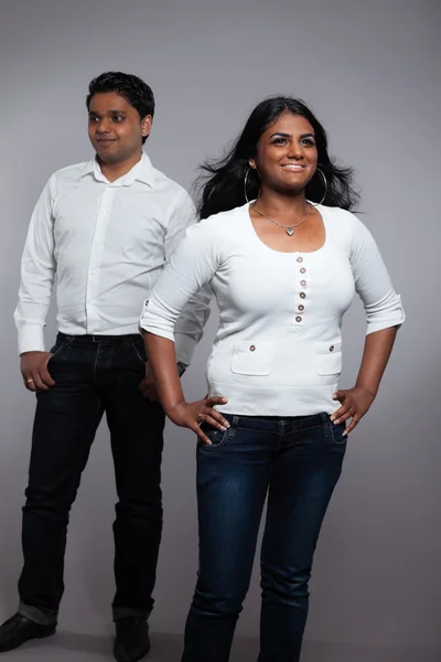 Young romantic indian couple. Wearing white shirt and jeans. Stu — Stock Photo, Image