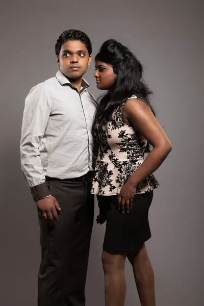 Fashionable passionate indian couple. Studio shot against grey. — Stock Photo, Image