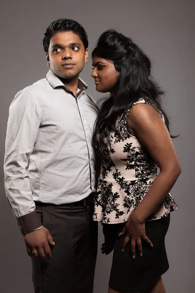 Fashionable passionate indian couple. Studio shot against grey. — Stock Photo, Image