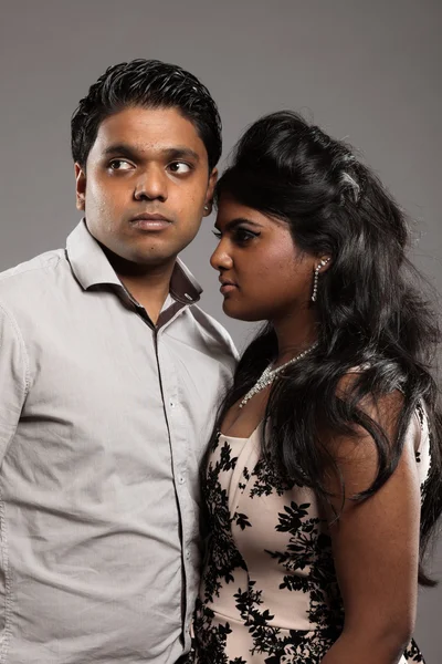 Fashionable passionate indian couple. Studio shot against grey. — Stock Photo, Image