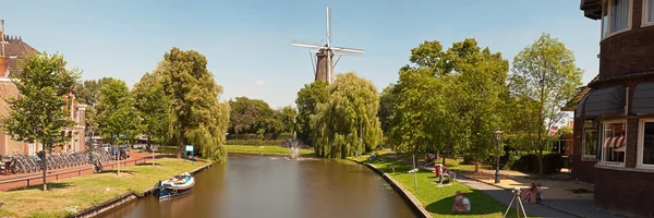 Panoramic photo of dutch city Leiden in summer. Canal and windmi — Stock Photo, Image