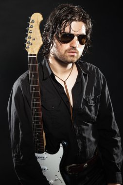 Rock guitarist with long brown hair and beard and sunglasses dre clipart