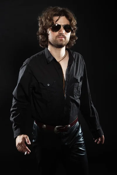 Cool rock style dancing musician with long brown hair and beard. — Stock Photo, Image