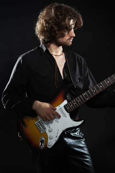 Psychedelic rock guitarist with long brown hair and beard. Dress — Stock Photo, Image