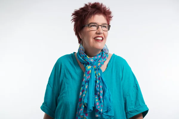 Happy smiling middle aged woman with red short hair and glasses. — Stock Photo, Image