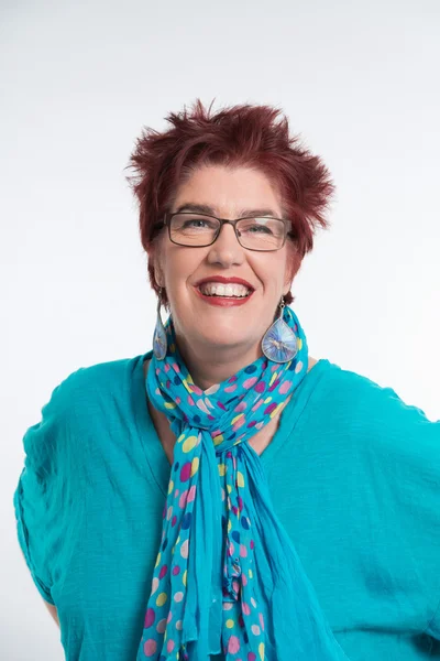 Happy smiling middle aged woman with red short hair and glasses. — Stock Photo, Image