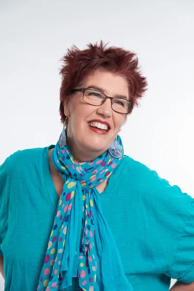 Happy smiling middle aged woman with red short hair and glasses. — Stock Photo, Image