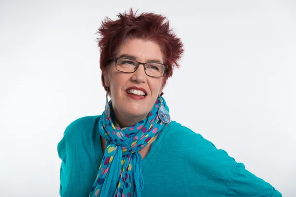 Happy smiling middle aged woman with red short hair and glasses. — Stock Photo, Image