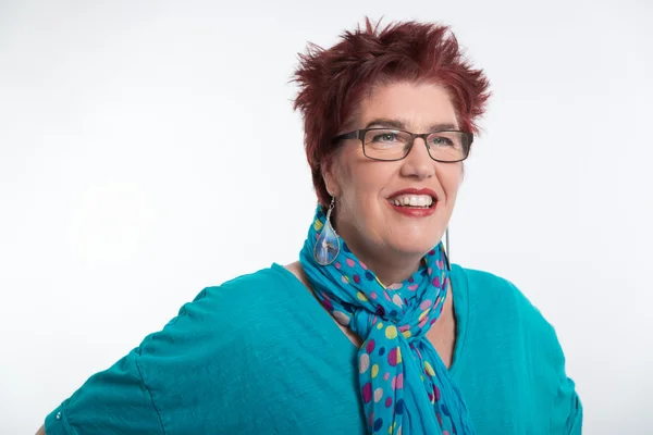 Happy smiling middle aged woman with red short hair and glasses. — Stock Photo, Image