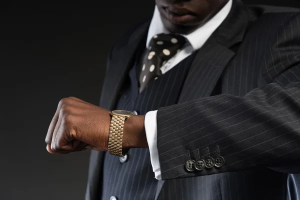 Retro african american gangster wearing striped suit and tie and — Stock Photo, Image