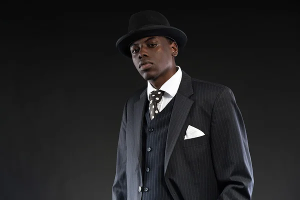 Retro african american gangster wearing striped suit and tie and — Stock Photo, Image