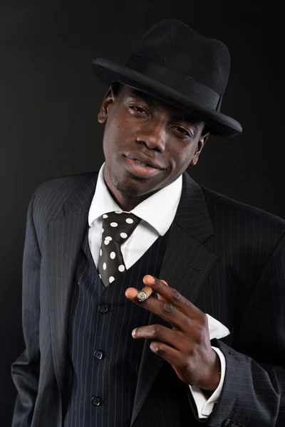 Retro african american mafia man wearing striped suit and tie an — Stock Photo, Image