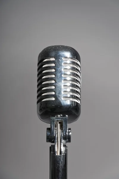 Retro microphone. Isolated studio shot against grey. — Stock Photo, Image