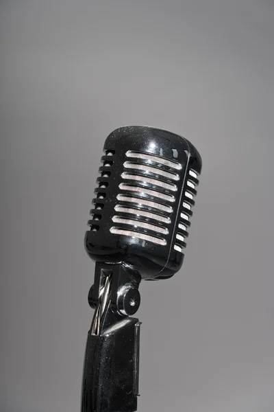 Retro microphone. Isolated studio shot against grey. — Stock Photo, Image