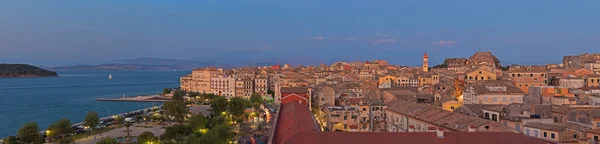 Panoramic shot of Corfu city with blue cloudy sky. At sunset. Ke — Stock Photo, Image