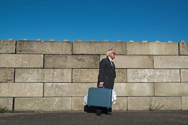 Lonely wandering depressed senior business man with sunglasses w — Stock Photo, Image