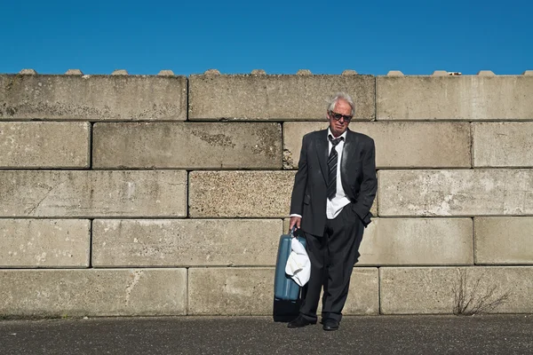 Lonely wandering depressed senior business man with sunglasses w — Stock Photo, Image