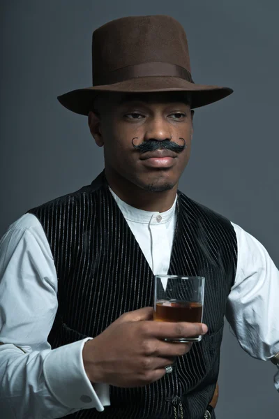 Vintage afro america western cowboy man with mustache. Drinking — Stock Photo, Image