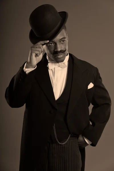 Retro afro american 1900 style man with mustache. Wearing black — Stock Photo, Image