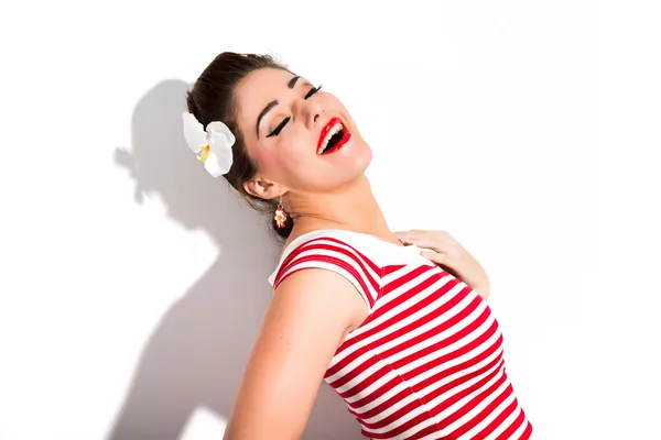 Sexy retro pin-up girl with red lipstick wearing red striped shi — Stock Photo, Image