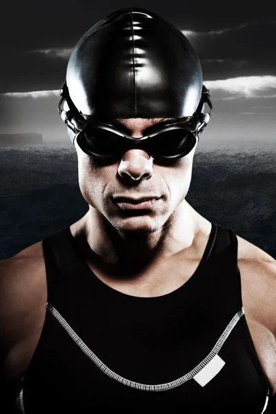 Triathlon swimmer man with cap and glasses outdoor at rough sea — Stock Photo, Image