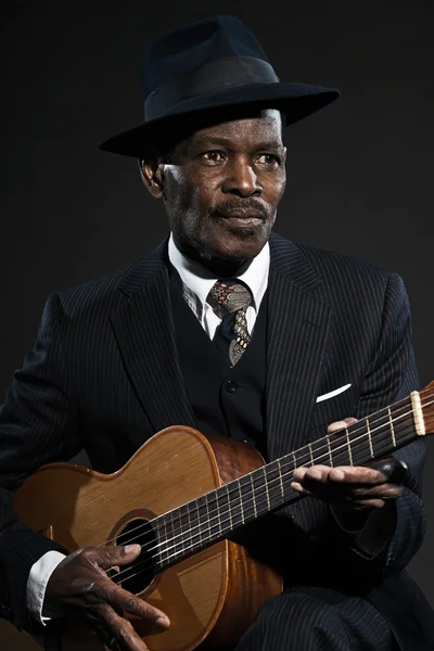 Retro senior afro american blues man. Wearing striped suit with — Stock Photo, Image