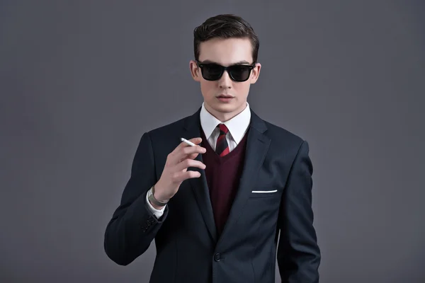 Retro fifties fashion young businessman with black sunglasses we — Stock Photo, Image