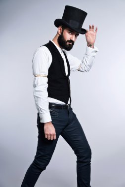 Retro hipster 1900 moda siyah saçlı ve sakallı adam. nedir